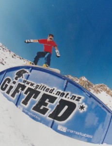 Chris on a snowboard on a rail